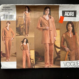 May include: A Vogue sewing pattern for a women's pantsuit. The pattern is for size B and includes four different views of the pantsuit. The pattern is printed on a white background with brown text and images.