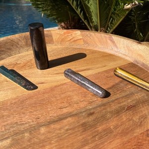 May include: Four crystal healing wands on a wooden tray. The wands are made of black obsidian, green aventurine, purple amethyst, and gold tiger's eye.