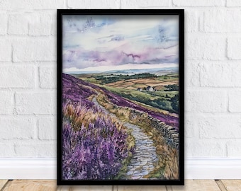 May include: Watercolor landscape painting in a black frame. The artwork depicts a path winding through a field of purple flowers and a stone wall, leading to a distant house. The sky is a mix of blue and purple.