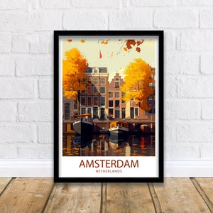 May include: A vintage travel poster featuring a colorful illustration of Amsterdam, Netherlands. The poster depicts a canal with boats and buildings lined with trees in autumn colors. The text "AMSTERDAM NETHERLANDS" is at the bottom of the poster.