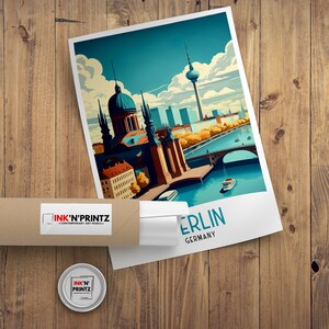 May include: A colorful illustration of the Berlin skyline featuring the Brandenburg Gate, the Reichstag building, and the Berlin TV Tower. The illustration is in a retro style with a blue sky and white clouds. The text "Berlin, Germany" is printed below the illustration.