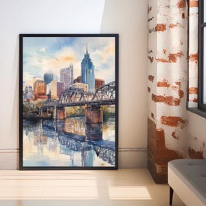 May include: A watercolor painting of the Nashville skyline with a bridge in the foreground. The painting features a blue sky with white clouds, and the buildings are painted in shades of gray, brown, and blue. The bridge is painted in black and gray, and the water is painted in shades of blue and green.