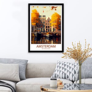 May include: A vintage travel poster featuring a colorful illustration of Amsterdam, Netherlands. The poster depicts a canal with two boats and buildings with yellow trees in the background. The text "AMSTERDAM" and "NETHERLANDS" is printed in brown at the bottom of the poster.