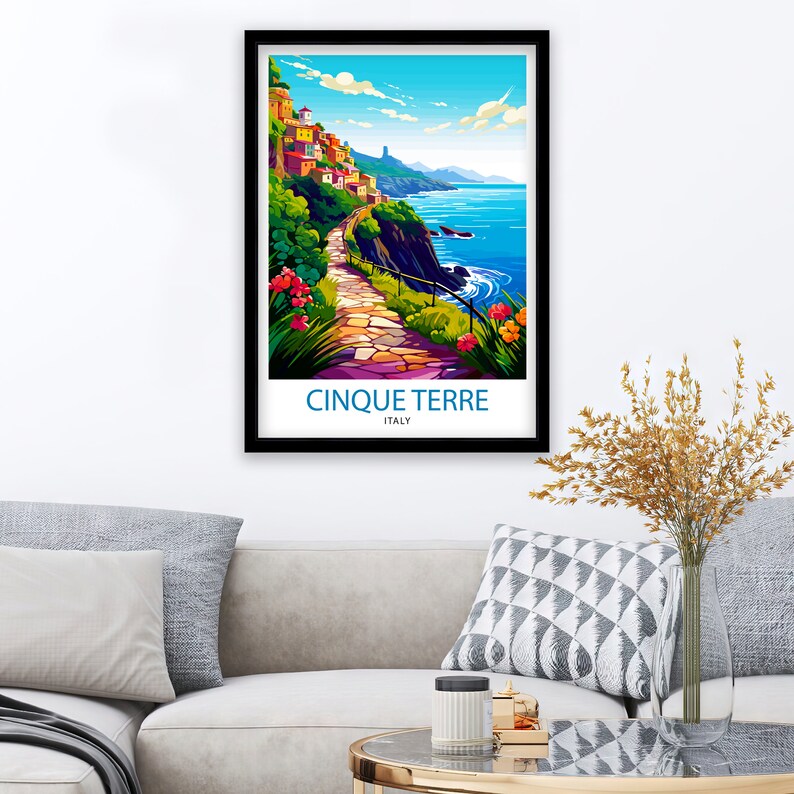 May include: A colorful illustration of a scenic path winding through a hillside village in Cinque Terre, Italy. The path leads to a blue ocean with white waves crashing on the shore. The text "Cinque Terre" and "Italy" is printed below the image.