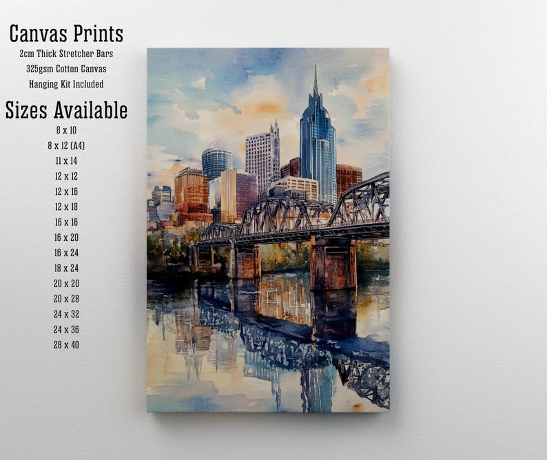 May include: A watercolor painting of a cityscape with a bridge over a river. The city skyline is reflected in the water. The painting is on a canvas with 2cm thick stretcher bars and a hanging kit included. Sizes available: 8x10, 8x12 (A4), 11x14, 12x12, 12x16, 12x18, 16x16, 16x20, 16x24, 18x24, 20x20, 20x28, 24x32, 24x36, 28x40.