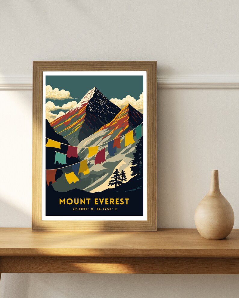 May include: A vintage-style poster featuring a colorful illustration of Mount Everest with prayer flags hanging in the foreground. The text "MOUNT EVEREST 27.9881&deg; N, 86.9250&deg; E" is printed below the mountain.
