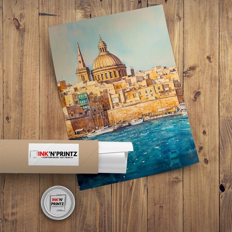 May include: Watercolor print of a coastal city with a large domed building and a tall spire. The artwork is in shades of yellow, blue, and brown. The print is rolled up in a cardboard tube with the text "INK'N'PRINTZ".