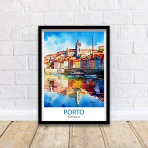 May include: A watercolor painting of the city of Porto, Portugal. The painting depicts colorful buildings lining the waterfront with boats docked in the water. The reflection of the buildings and boats can be seen in the water. The text "PORTO" and "PORTUGAL" is written in blue at the bottom of the painting.