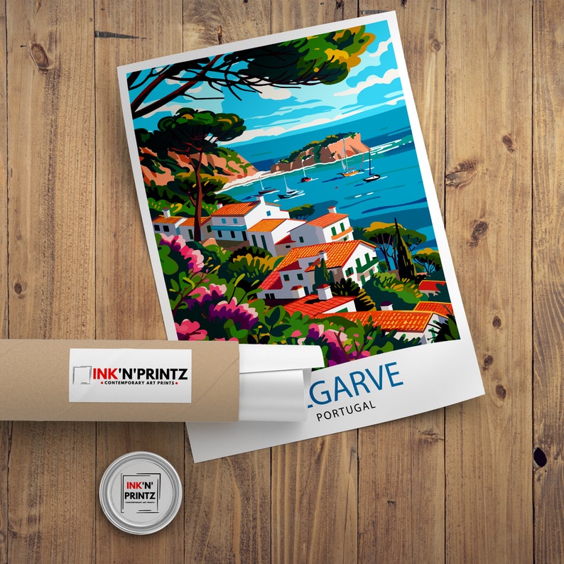 May include: A colorful illustration of a coastal town in Portugal. The image features white buildings with red tile roofs, lush green trees, and a blue ocean with boats. The text "LAGARVE PORTUGAL" is printed at the bottom of the image.