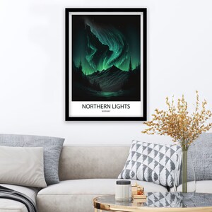 May include: A black framed poster with a green and black illustration of the Northern Lights over a mountain range. The text "NORTHERN LIGHTS" and "NORWAY" is printed below the image.