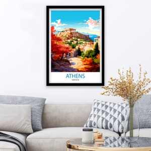 May include: A vintage travel poster featuring a colorful illustration of the Acropolis in Athens, Greece. The poster has a blue sky with white clouds and a green hillside with red and orange trees. The text "ATHENS GREECE" is at the bottom of the poster.