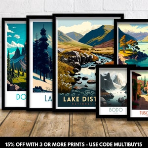 May include: Set of five illustrated travel posters featuring scenic landscapes. The posters are framed in black and have white text. The posters feature locations such as Lake District National Park, Bodo, Norway, Tuscany, Italy, and more.