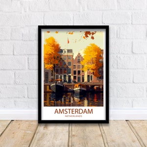 May include: A vintage travel poster featuring a colorful illustration of Amsterdam, Netherlands. The poster depicts a canal with boats and buildings lined with trees in autumn colors. The text "AMSTERDAM" and "NETHERLANDS" is displayed at the bottom of the poster.
