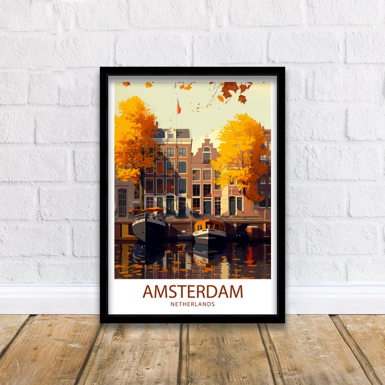 May include: A vintage travel poster featuring a colorful illustration of Amsterdam, Netherlands. The poster depicts a canal with boats and buildings lined with trees in autumn colors. The text "AMSTERDAM NETHERLANDS" is at the bottom of the poster.