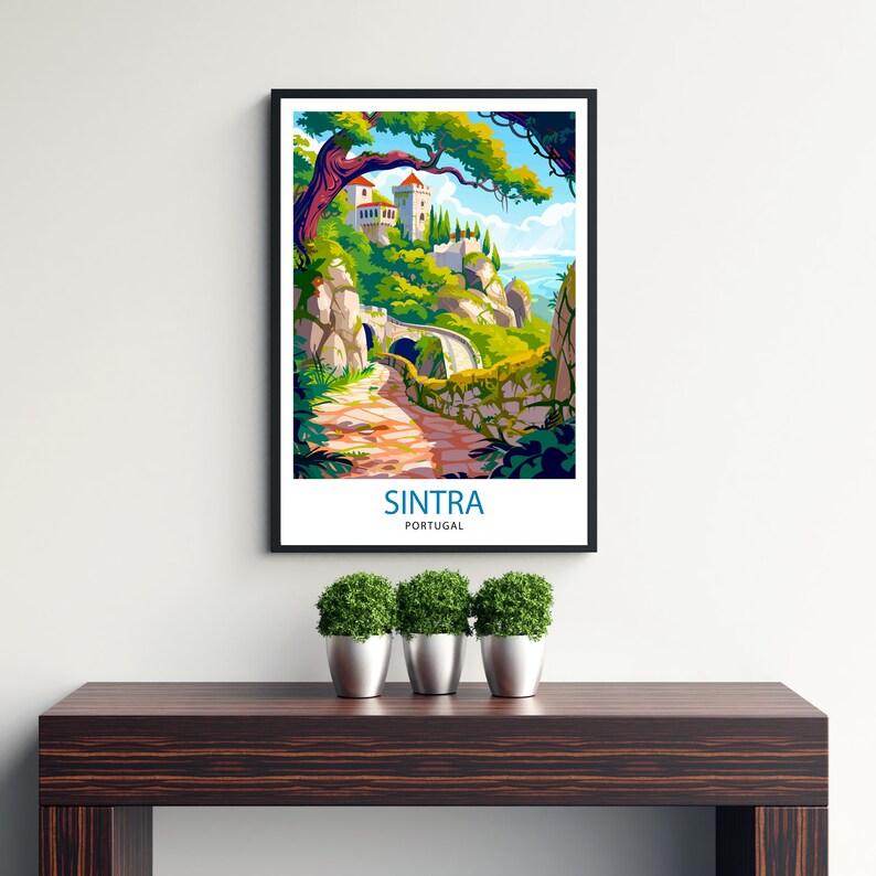 May include: A colorful illustration of a castle in Sintra, Portugal. The castle is perched on a hilltop with a winding path leading up to it. The illustration is framed in black and surrounded by green plants.