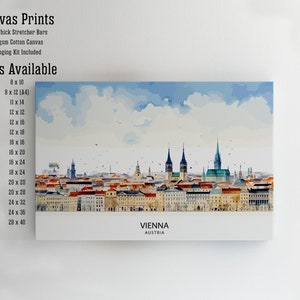 Peut inclure: Une peinture &agrave; l'aquarelle de l'horizon de Vienne, avec plusieurs b&acirc;timents aux toits rouges et quelques fl&egrave;ches hautes. La peinture est sur une toile avec une bordure blanche et le texte "VIENNE AUTRICHE" en bas. Le texte "Tailles disponibles" est list&eacute; sur le c&ocirc;t&eacute; gauche de l'image avec une liste de diff&eacute;rentes tailles en pouces.