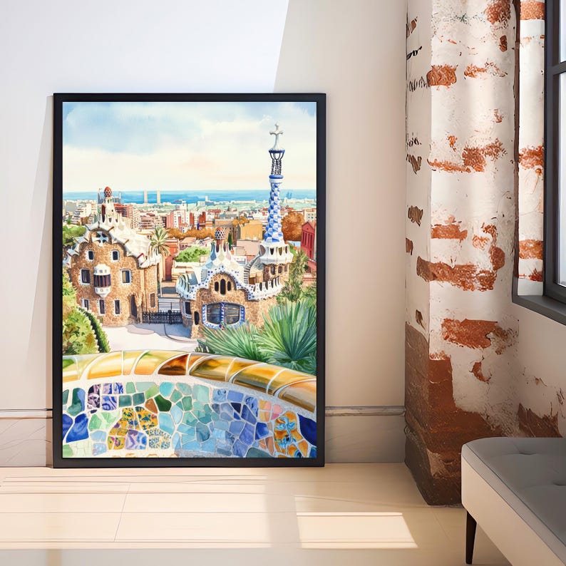 May include: Watercolor painting of Park G&uuml;ell in Barcelona, Spain, framed in black. The artwork depicts the park's architecture, including the iconic mosaic benches and the colorful tiled tower. The sky is blue with a few clouds.