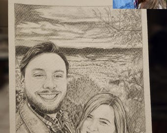May include: A black and white pencil drawing of a couple in a scenic landscape. The couple is smiling and looking at the camera. The drawing is on a white background.