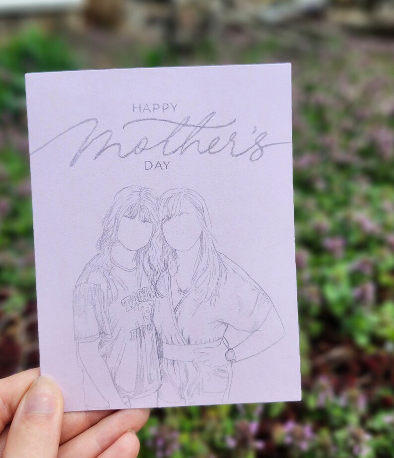 May include: A light purple card with the text "Happy Mother's Day" in cursive script. A pencil sketch of two women standing side-by-side is below the text.