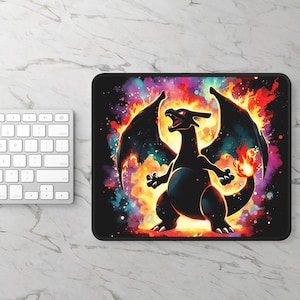 May include: Black mousepad featuring a stylized illustration of a black dragon with red eyes and fiery wings. The dragon is set against a colorful background of orange, yellow, purple, and blue. The mousepad has a black border.