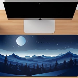 May include: A blue and white mouse mat featuring a starry night sky with a mountain range silhouette. The moon is visible in the sky.