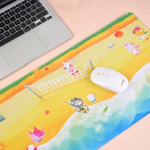 May include: A rectangular mousepad with a beach scene featuring cartoon animals. The design includes a volleyball net, ocean waves, and characters sunbathing and playing. A white wireless mouse and a laptop are also visible.