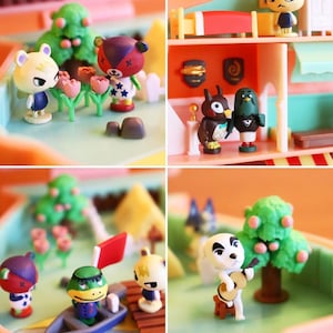 May include: A miniature playset featuring characters from the Animal Crossing video game series. The set includes a house with a bedroom, a living room, and a kitchen. There are also several outdoor areas, including a park, a river, and a beach. The characters are all made of plastic and are painted in bright colors.