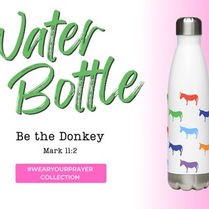 May include: A white stainless steel water bottle featuring a colourful donkey design. The bottle has the text "Be the Donkey" and "Mark 11:2" printed on it. The bottle is part of the #WEARYOURPRAYER collection.