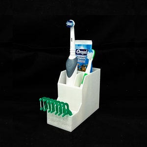 Super Toothbrush Holder with floss picks that will get your child to floss more frequently!