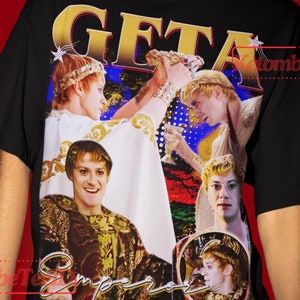 May include: Black t-shirt with a colorful graphic print of a group of people wearing crowns and robes. The text "GETA" is printed in gold letters on the shirt. The model is wearing a 2XL size shirt. The text "The model wears 2XL sized shirt, It's Unisex shirt true to size, And to get to Oversize looks, You have to choose +1 or +2 of Your original size number." is printed at the bottom of the image.