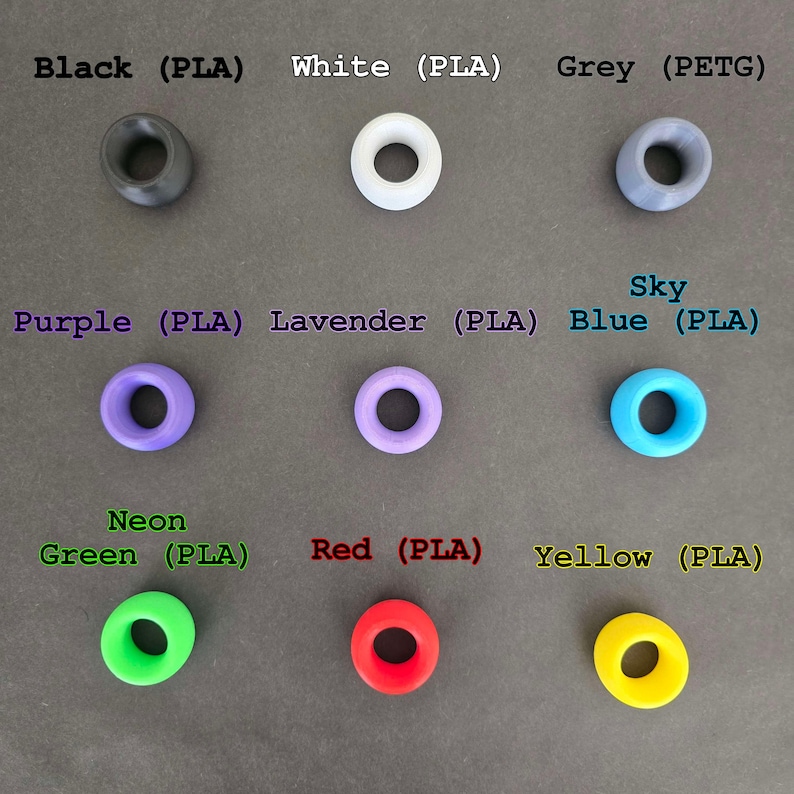 May include: Assortment of 10 colorful plastic rings in various colors, including black, white, grey, purple, lavender, sky blue, neon green, red, and yellow. The rings are made of PLA and PETG plastic.