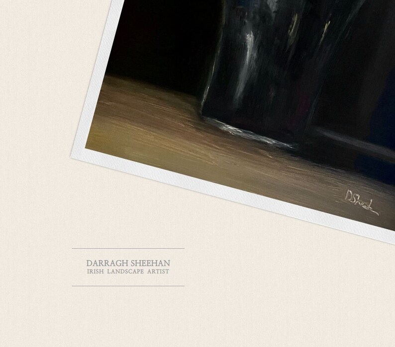 May include: An oil painting by Darragh Sheehan, an Irish landscape artist. The artwork features a dark, glossy object, possibly a vase, on a wooden surface. The artist's signature is visible in the lower right corner.