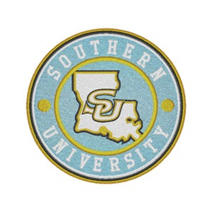 May include: A circular embroidered patch featuring a light blue background with a white outline of the state of Louisiana. The letters SU are centred in yellow and white. The text SOUTHERN UNIVERSITY is arched in white around the border.