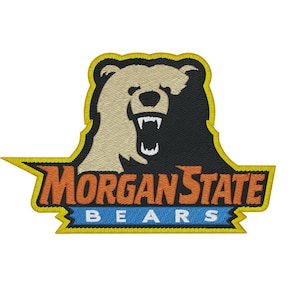 May include: An embroidered patch featuring a bear head split between tan and black colors. Below the bear, the text MORGAN STATE is stitched in orange, followed by the word BEARS in white on a blue background, all outlined in yellow.