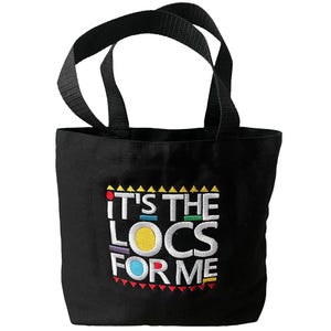 May include: Black canvas tote bag with the text "It's the Locs for Me" in colorful embroidered letters.
