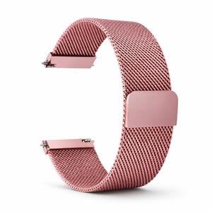 May include: A rose gold watch band with a mesh design. The band has a magnetic clasp and is made of a flexible, woven material. The band is curved and ready to be attached to a watch.