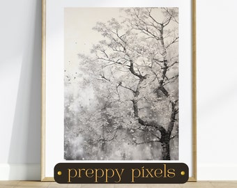 May include: A black and white watercolor painting of a tree with branches reaching up towards the sky. The background is a soft, light gray with a subtle texture. The painting is framed in a light wood frame.