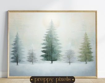 May include: A framed landscape painting depicts a winter scene with evergreen trees in varying shades of green and gray, set against a soft, hazy background. The artwork is encased in a light-colored wooden frame. The text "preppy pixels" is at the bottom.