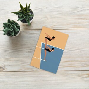 May include: Two figures in black and white polka dot swimsuits with swim caps are standing on a diving board, preparing to dive into a blue pool. The background is a light orange color.