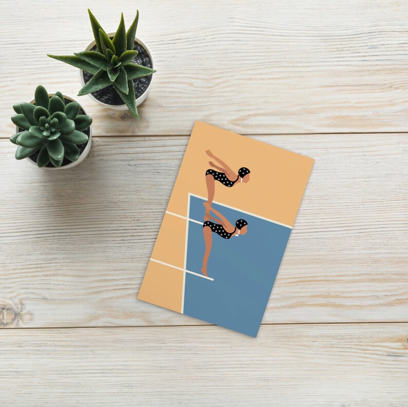 May include: Two figures in black and white polka dot swimsuits with swim caps are standing on a diving board, preparing to dive into a blue pool. The background is a light orange color.
