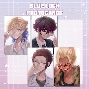 May include: Four rectangular Blue Lock photocards featuring anime-style illustrations of characters wearing glasses. The top text reads BLUE LOCK PHOTOCARDS. The characters have distinct hair colours and styles, including blonde, dark purple, and brown.