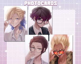 May include: Four rectangular Blue Lock photocards featuring anime-style illustrations of characters wearing glasses. The top text reads BLUE LOCK PHOTOCARDS. The characters have distinct hair colors and styles, including blonde, dark purple, and brown.