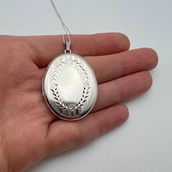 Vintage sterling silver etched oval locket, signed Marathon
