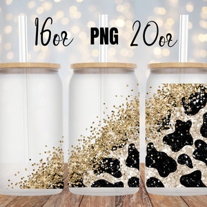 May include: Three clear plastic tumblers with lids and straws. The tumblers are 16oz and 20oz. The tumblers have a gold glitter and black and white cow print design.