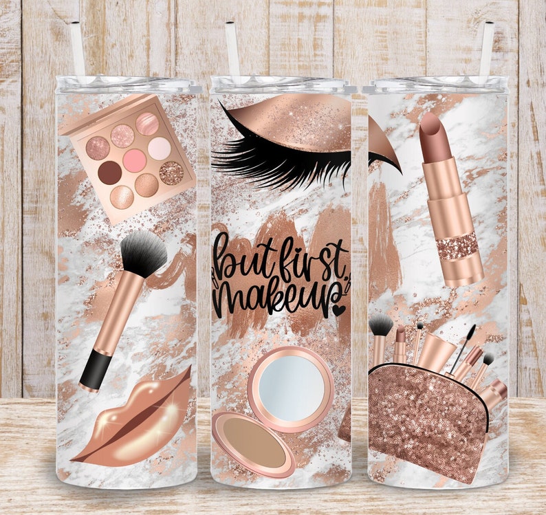May include: Three stainless steel tumblers with rose gold accents and a makeup theme. The first tumbler features a makeup palette, a makeup brush, and a rose gold lip. The second tumbler features a rose gold eye with eyelashes, a compact mirror, and the text "but first makeup". The third tumbler features a rose gold lipstick, a makeup bag with brushes, and a rose gold glitter background.