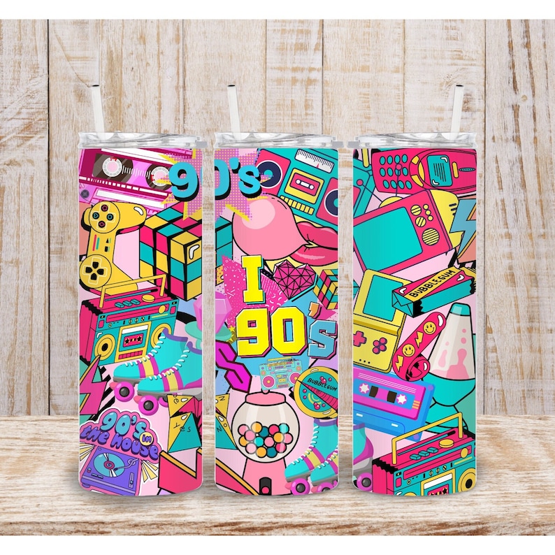 May include: Three 90's themed stainless steel tumblers with colorful graphics of 90's icons like cassette tapes, roller skates, game controllers, and bubble gum. The tumblers are pink, blue, and yellow.