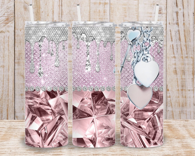 May include: Three pink and silver glitter tumbler designs. The first design features a pink glitter background with silver glitter drips. The second design features a pink glitter background with silver glitter drips and a pink and silver diamond pattern. The third design features a pink and silver diamond pattern with a silver key and two silver hearts.
