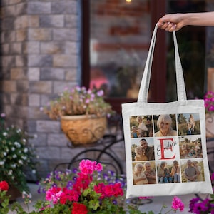 May include: White canvas tote bag with a photo collage of a family. The photos are arranged in a grid pattern and feature a red letter "E" with the name "Evelyn" written in cursive.
