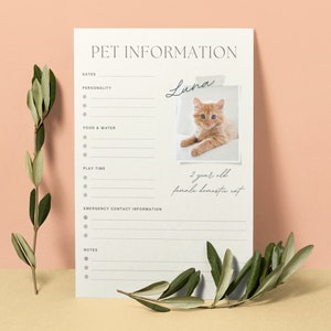 May include: A pet information sheet with the title "PET INFORMATION" and sections for dates, personality, food & water, play time, emergency contact information, and notes. Includes a photo of an orange cat named Luna, who is 2 years old. Green leaves are in the foreground.