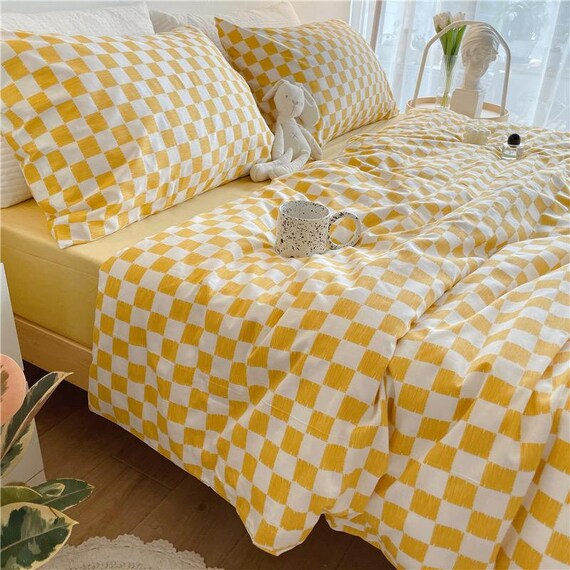Yellow and cheap white bedding